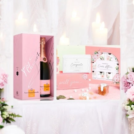 Gift box containing Veuve Clicquot Rose and Happily Ever After Gift set.
