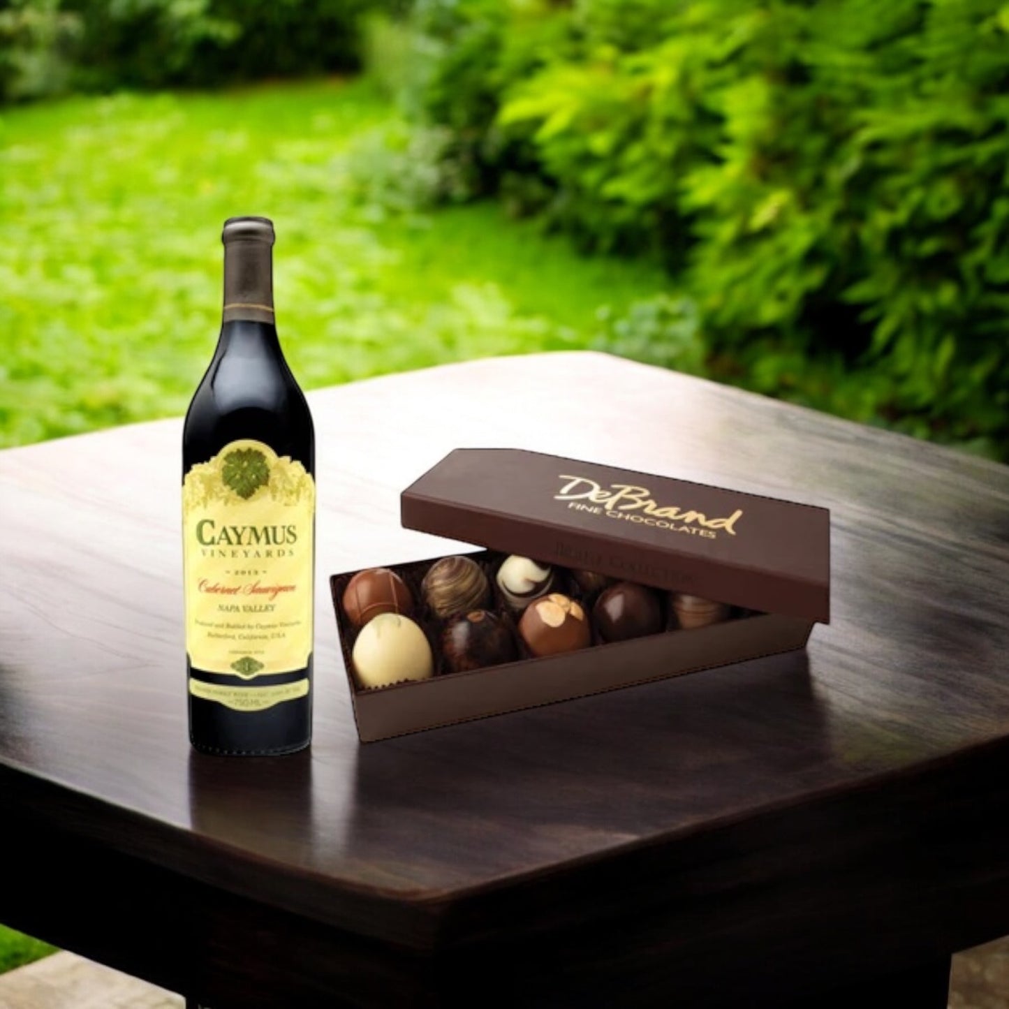 Gift box containing Caymus Cabernet Sauvignon and artisan and 12pc. artisan chocolates.
