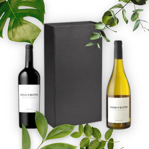 Sleek black Gft box containing a bottle of red and white wine.