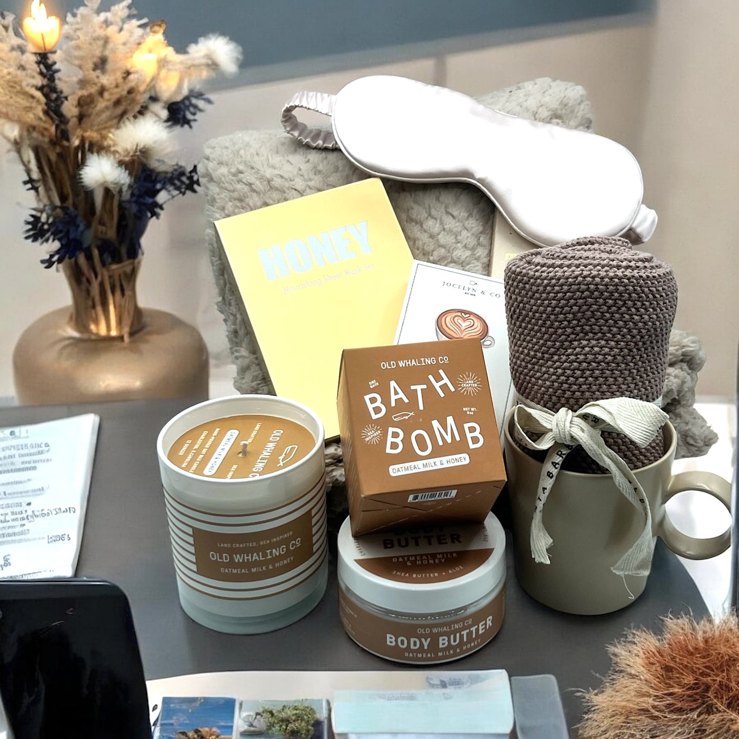 Gourmet Gift Basket filled with bath products, creamy caramels, cozy blanket, face mask, mug and dish towel. Shipped nationwide from NYC.