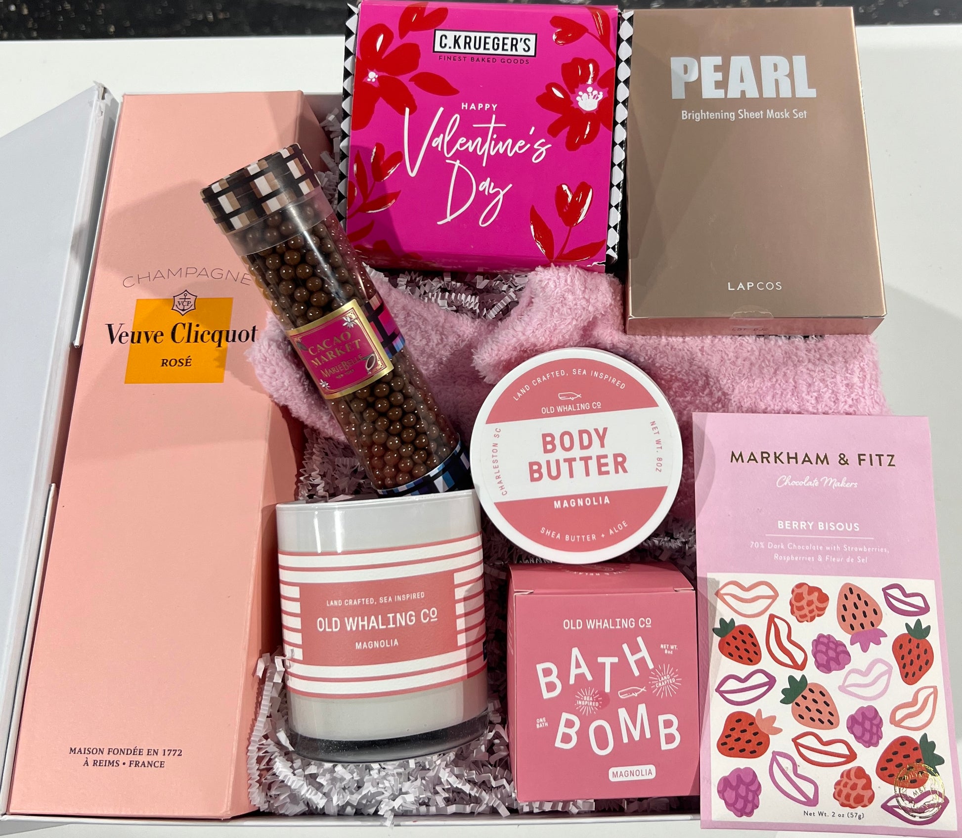 Valentine's Day Gift box filled with bath products, cookies, artisan chocolates and fuzzy socks.