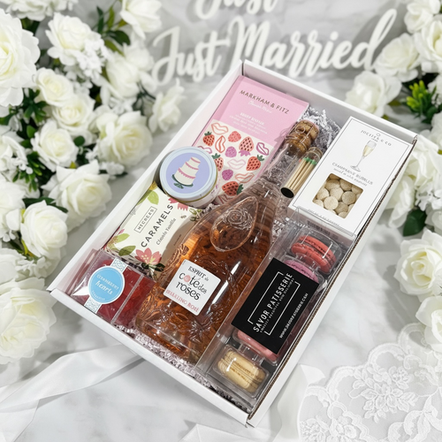 Cote de Roses sparkling rose with wedding cake candle, matches, caramels, candies, macarons & artisan chocolate bar.