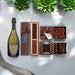 Gift box filled with Dom Perignon Champagne and artisan chocolates.