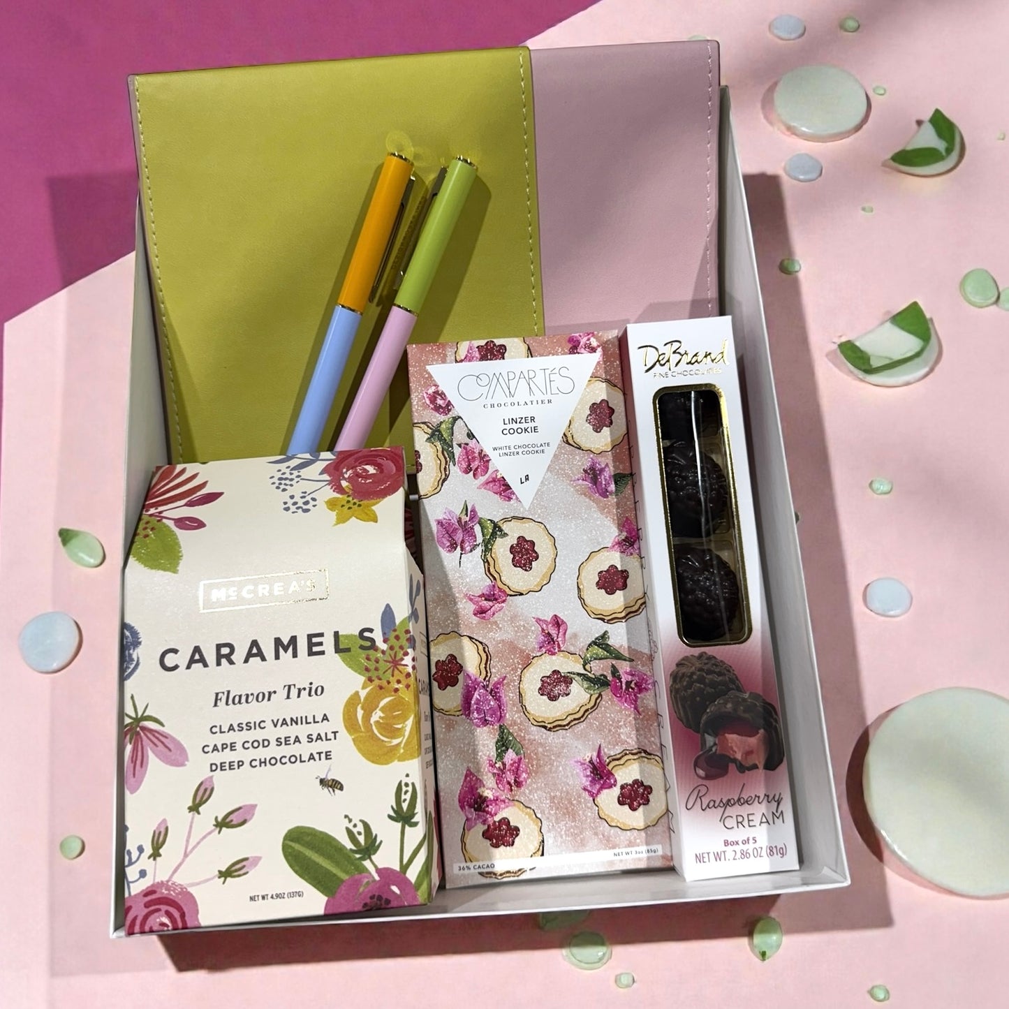 Vegan leather journal, pens, caramels, artisan chocolate bars.
