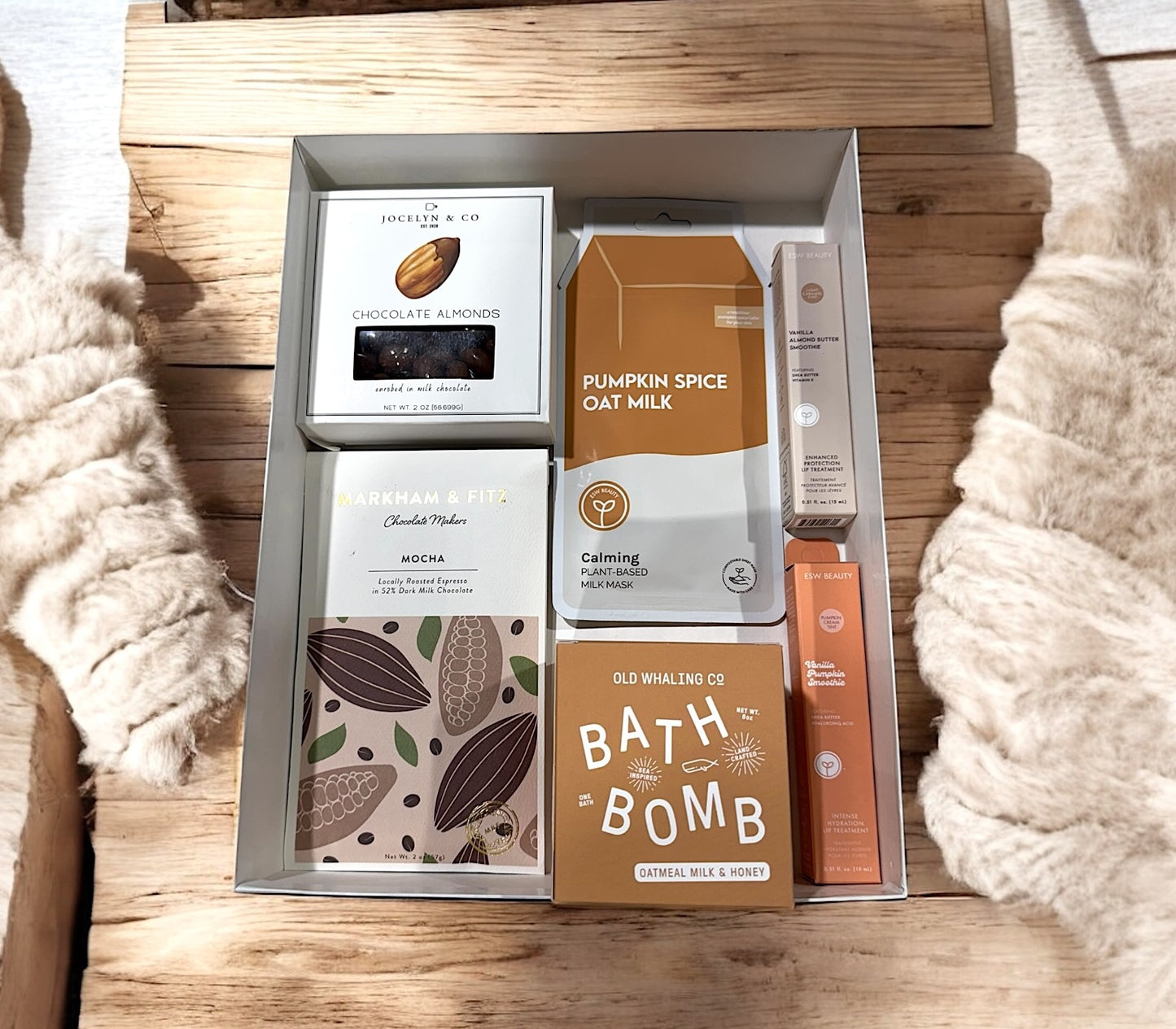 Oatmeal bath bomb, pumpkin spice oat milk face mask, Chocolate covered almonds, lip balm, & mocha artisan chocolate bar.
