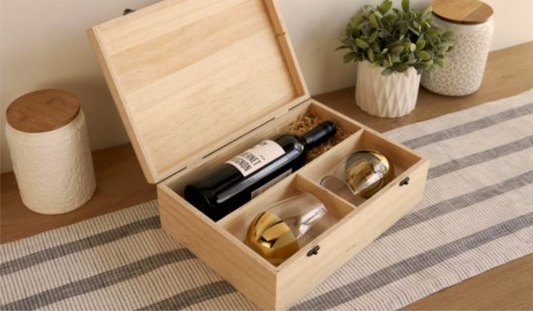 Wood crate containing wine and glasses.