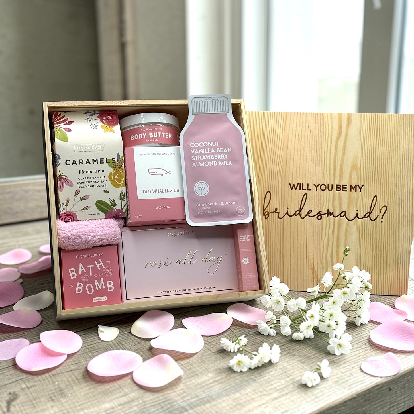 Will You Be My Bridesmaid gift box with self care products, caramels, socks and candies.