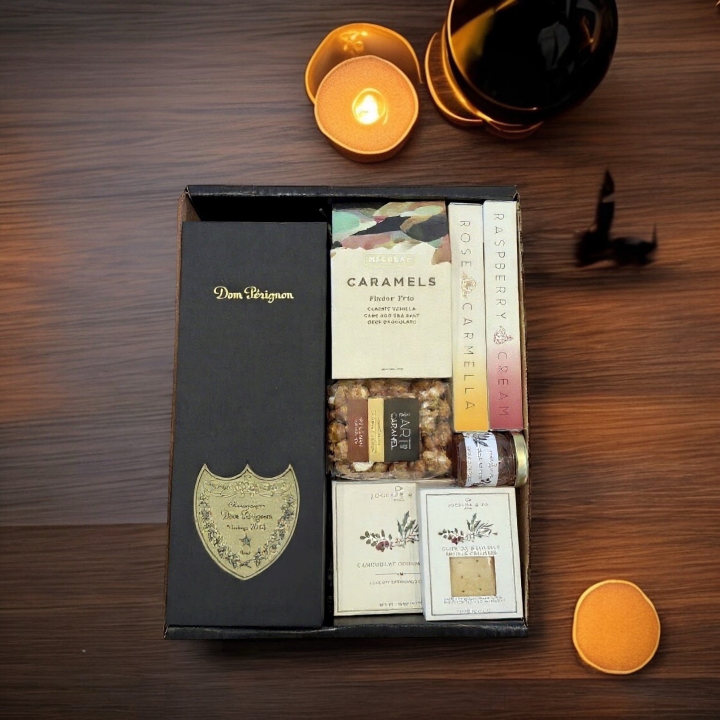 Dom Perignon w/artisan chocolates, cheese, crackers, popcorn & jam